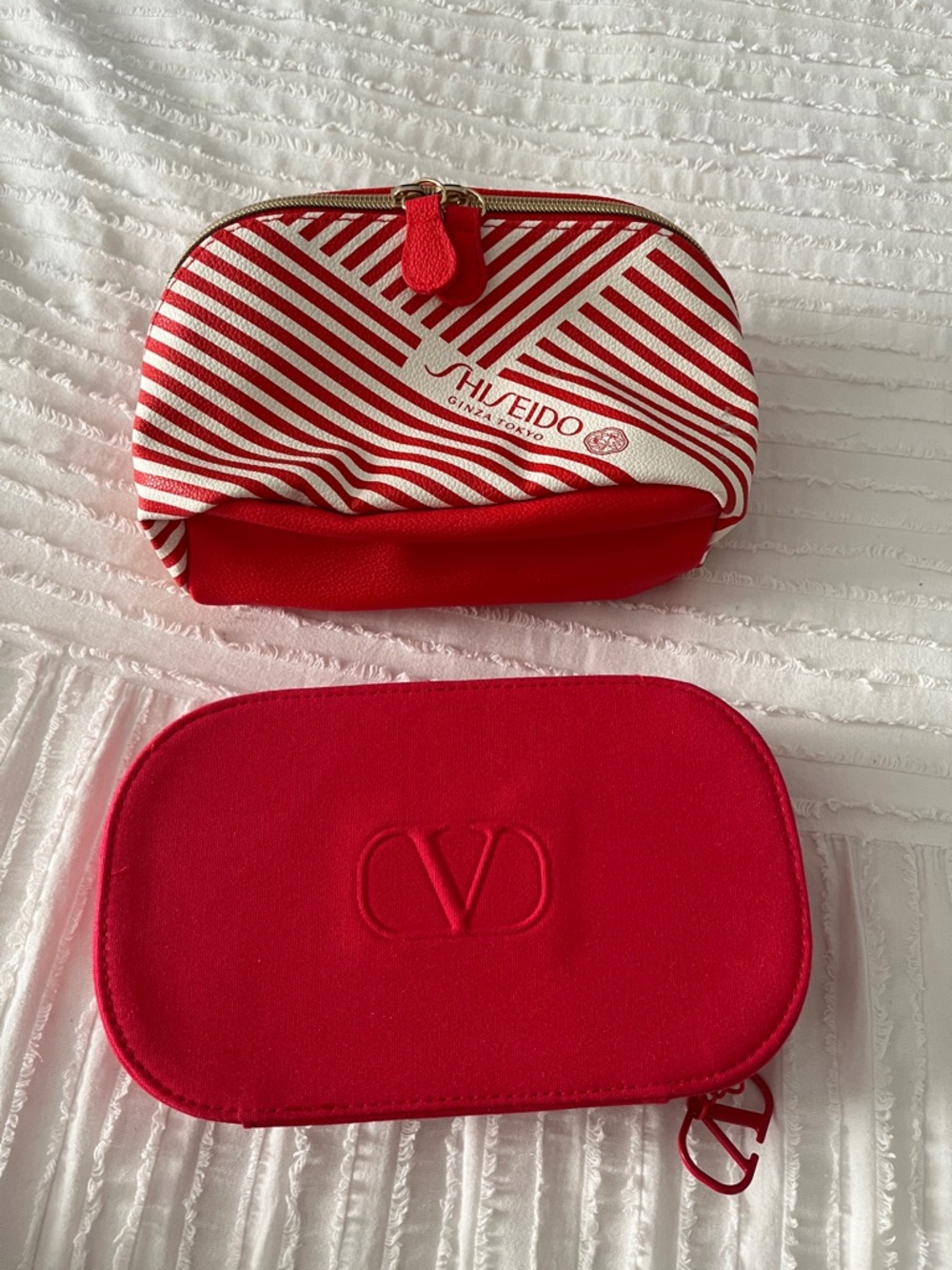 Shiseido Red and White Striped Cosmetic Pouch and Valentino cosmetic pouch